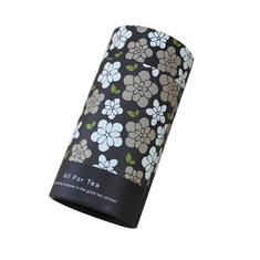 Eco-friendly matte kraft paper black cylindrical tea packaging, decorated with floral patterns