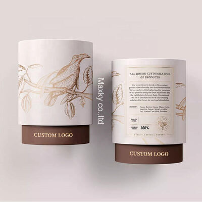 Custom-made eco-friendly, food-grade kraft paper coffee, tea, and salt bottles, packaged in cylindrical cardboard boxes.