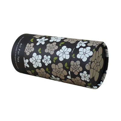 Eco-friendly matte kraft paper black cylindrical tea packaging, decorated with floral patterns