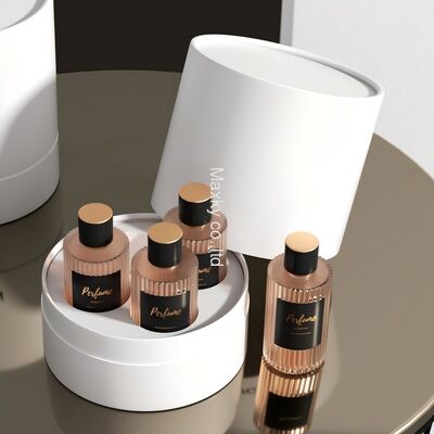 A custom-designed luxury textured leather cylindrical box, an eco-friendly 6ml fragrance packaging set including a paper tube.