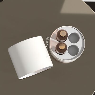 A custom-designed luxury textured leather cylindrical box, an eco-friendly 6ml fragrance packaging set including a paper tube.