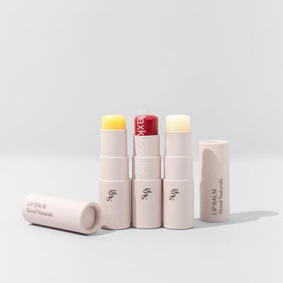 Biodegradable cosmetic packaging for lip balms and deodorants in cylindrical containers.
