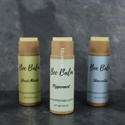 Custom-printed cardboard deodorizing stick containers; recyclable lip balm wrappers.