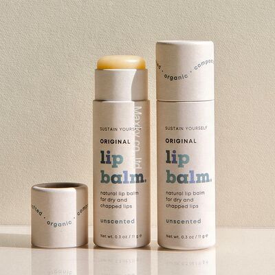 Custom-printed cardboard deodorizing stick containers; recyclable lip balm wrappers.