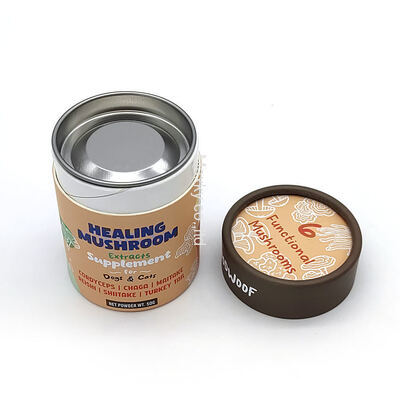 Printed cylindrical aluminum foil cardboard tea canisters, food-grade paper tube packaging, with metal lids.