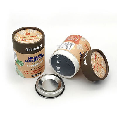 Printed cylindrical aluminum foil cardboard tea canisters, food-grade paper tube packaging, with metal lids.