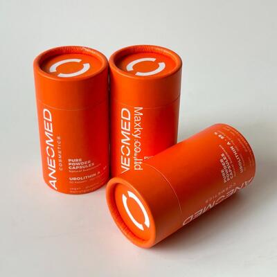 Biodegradable orange essential oil bottle packaging tubes, cardboard perfume and cosmetic paper tubes, custom tea paper tubes